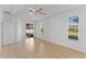 Bright bedroom featuring tile floors and views of nature through two windows at 3281 Pawleys N Loop, St Cloud, FL 34769