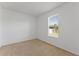 Cozy bedroom with carpet flooring, one window, and a neutral color palette at 3281 Pawleys N Loop, St Cloud, FL 34769