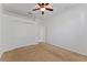 Neutral bedroom features a closet with bi-fold doors and a ceiling fan at 3281 Pawleys N Loop, St Cloud, FL 34769