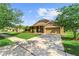 Beautiful suburban home with well-maintained lawn, mature trees, and a two-car garage on a sunny day at 3281 Pawleys N Loop, St Cloud, FL 34769