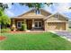 Charming single-Gathering home featuring a well-manicured lawn and attached two car garage at 3281 Pawleys N Loop, St Cloud, FL 34769