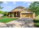 Charming single-Gathering home featuring a well-manicured lawn and attached two car garage at 3281 Pawleys N Loop, St Cloud, FL 34769