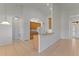 Open concept featuring kitchen cabinets and appliances with tile floors leading to multiple rooms at 3281 Pawleys N Loop, St Cloud, FL 34769
