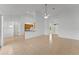 Spacious open-concept living room with tile flooring and views into the kitchen and entry at 3281 Pawleys N Loop, St Cloud, FL 34769