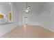 Expansive living room with neutral tile flooring and open access to other areas of the home at 3281 Pawleys N Loop, St Cloud, FL 34769