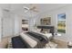Comfortable main bedroom with ceiling fan and access to a private patio at 3281 Pawleys N Loop, St Cloud, FL 34769