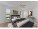 Comfortable main bedroom with neutral color palette, ceiling fan, and two windows at 3281 Pawleys N Loop, St Cloud, FL 34769