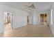 Spacious main bedroom with tile floors leading to the ensuite bathroom and walk-in closet at 3281 Pawleys N Loop, St Cloud, FL 34769