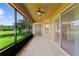 Covered patio features tile floor, fan and access to green outdoor areas at 3281 Pawleys N Loop, St Cloud, FL 34769
