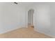 Empty room featuring neutral tones and a modern archway at 3281 Pawleys N Loop, St Cloud, FL 34769