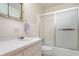 Neutral bathroom with a vanity and shower featuring a white vanity with solid surface top and glass shower doors at 360 Westchester Dr, Deland, FL 32724