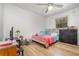 Well-lit bedroom with vinyl floors and a ceiling fan offers a comfortable and relaxing retreat at 360 Westchester Dr, Deland, FL 32724