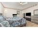 This bedroom features wood-look flooring, a floral border, ceiling fan, and coordinated decor at 360 Westchester Dr, Deland, FL 32724
