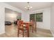 Cozy dining room with wood floors, chandelier, and natural light creating an inviting atmosphere at 360 Westchester Dr, Deland, FL 32724