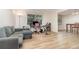 Living room with hardwood floors, neutral paint, with large window letting in ample natural light at 360 Westchester Dr, Deland, FL 32724