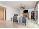 Living room featuring a brick fireplace, tile floors, and sliding glass doors at 360 Westchester Dr, Deland, FL 32724