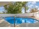 Refreshing pool surrounded by a concrete patio and secure fencing offering a relaxing outdoor space at 360 Westchester Dr, Deland, FL 32724