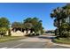 Lakes of DeLand entrance featuring lush landscaping and a welcoming street view, perfect for a 55+ active lifestyle at 3609 Azurite Ct, Deland, FL 32724