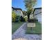Entrance to the community nature trail between two buildings at 3609 Azurite Ct, Deland, FL 32724