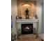 Cozy living room fireplace with decorative tile surround and mantel, providing a relaxing focal point at 3609 Azurite Ct, Deland, FL 32724