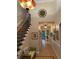 Elegant foyer featuring a decorative light fixture, staircase, and high ceilings at 3609 Azurite Ct, Deland, FL 32724