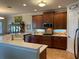 Spacious kitchen features modern appliances, wooden cabinets, and tile flooring at 3609 Azurite Ct, Deland, FL 32724