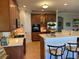Well-equipped kitchen features tile flooring, wooden cabinets, and stainless steel appliances at 3609 Azurite Ct, Deland, FL 32724