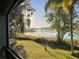 Relax on the screened porch and enjoy the serene water views and lush landscape at 3609 Azurite Ct, Deland, FL 32724