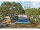 Aerial view of a home showcasing its backyard with a storage shed and the surrounding neighborhood at 451 Hibiscus Rd, Casselberry, FL 32707