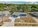 Elevated view showcases the home's new roof, driveway, and the surrounding neighborhood at 451 Hibiscus Rd, Casselberry, FL 32707