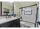 Updated bathroom featuring sleek vanity, decorative shower, and modern fixtures at 451 Hibiscus Rd, Casselberry, FL 32707