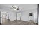 Spacious bedroom with modern flooring, light gray walls, and ample closet space at 451 Hibiscus Rd, Casselberry, FL 32707