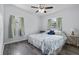 Bedroom with two side tables, vinyl floors, ceiling fan, and 2 windows at 451 Hibiscus Rd, Casselberry, FL 32707