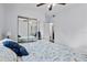 Bedroom with vinyl floors and a large mirror closet, providing style and functionality at 451 Hibiscus Rd, Casselberry, FL 32707
