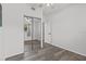 Spacious bedroom with vinyl flooring and a large mirror closet door at 451 Hibiscus Rd, Casselberry, FL 32707