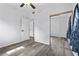 Bedroom with closet, vinyl flooring, natural light, and white walls at 451 Hibiscus Rd, Casselberry, FL 32707
