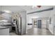 Modern kitchen features stainless steel appliances, gray cabinets, and an open layout at 451 Hibiscus Rd, Casselberry, FL 32707