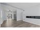 Spacious living room with open layout to the kitchen and modern gray vinyl floors at 451 Hibiscus Rd, Casselberry, FL 32707