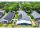 Home exterior featuring solar panels, a fenced backyard, and a screened-in patio at 578 Darkwood Ave, Ocoee, FL 34761
