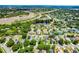 Beautiful aerial view of a residential neighborhood with a pond, green trees, and easy access to a major highway at 578 Darkwood Ave, Ocoee, FL 34761