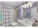 Cozy bathroom with shower over tub and vanity mirror at 578 Darkwood Ave, Ocoee, FL 34761
