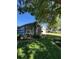 Attractive one-story home with lush landscaping, featuring a turquoise front door and well-kept lawn at 578 Darkwood Ave, Ocoee, FL 34761