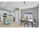 Bright kitchen with island, stainless appliances, and dining area at 578 Darkwood Ave, Ocoee, FL 34761
