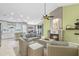 Bright living room with fireplace, kitchen and outdoor access at 578 Darkwood Ave, Ocoee, FL 34761