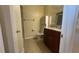 Bathroom features granite-topped vanity, tile flooring, and walk-in shower at 6654 Hiawassee Meadows Dr, Orlando, FL 32818