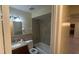 Neutral toned bathroom featuring a tub and shower combination with a granite vanity at 6654 Hiawassee Meadows Dr, Orlando, FL 32818