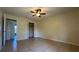 Bedroom with tile flooring, ceiling fan, and closet, perfect for relaxation at 6654 Hiawassee Meadows Dr, Orlando, FL 32818
