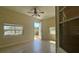 Bonus room featuring tile floors and natural light from a large doorway to the outdoors at 6654 Hiawassee Meadows Dr, Orlando, FL 32818