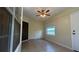 Bonus room featuring a ceiling fan, tiled floors, and natural light from the window at 6654 Hiawassee Meadows Dr, Orlando, FL 32818
