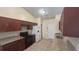 Beautiful kitchen featuring granite counters, dark cabinets, and stainless steel appliances at 6654 Hiawassee Meadows Dr, Orlando, FL 32818